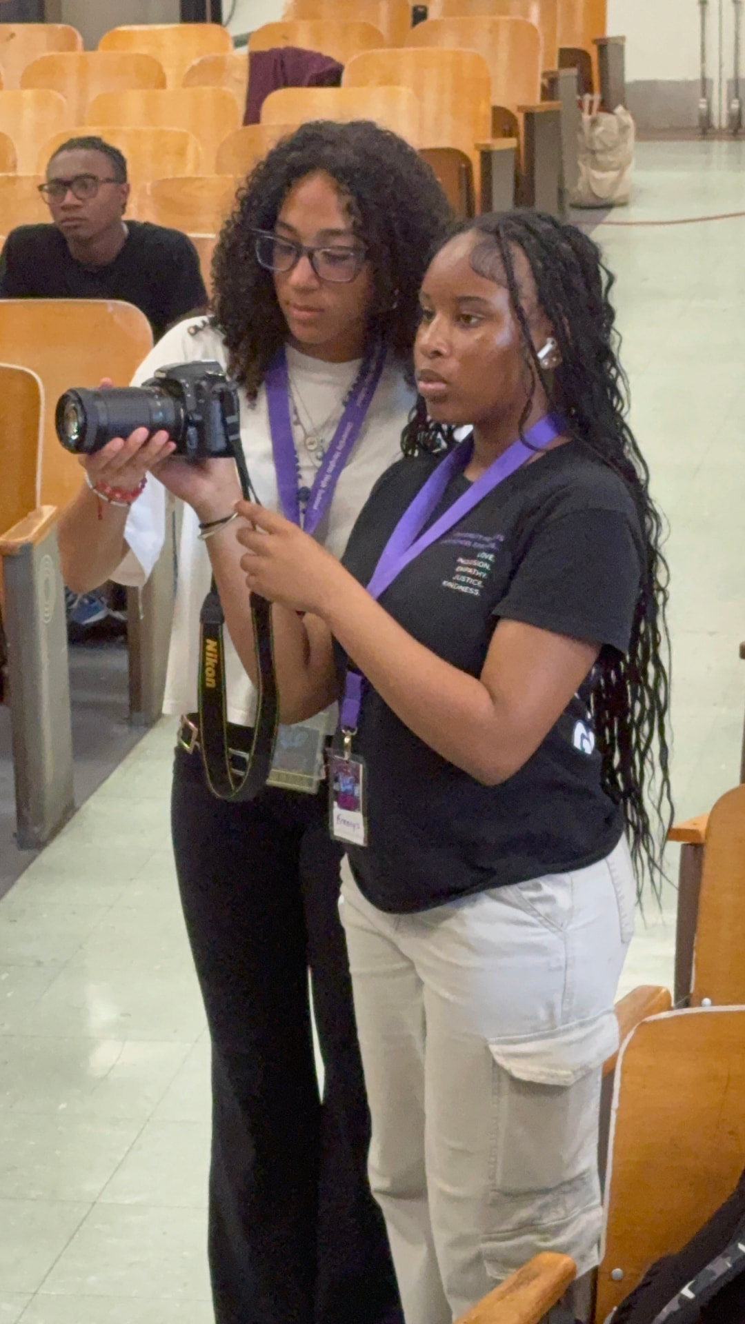 A mentor teaching camera operation